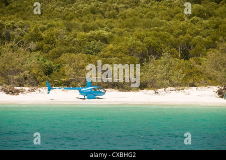 Helicopter on Whitsunday Island's  Whitehaven beach, Queensland Australia Stock Photo