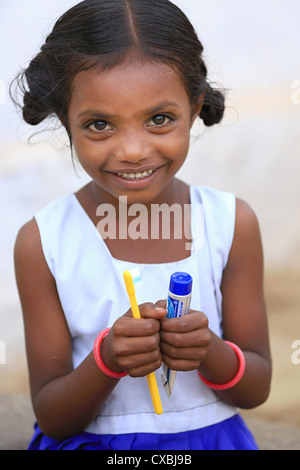 Indian school girl Dhanama with tooth brush and tooth paste Andhra Pradesh South India Stock Photo