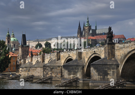 Prague Castle and Charles Bridge as seen from the banks of the River Vltava Stock Photo