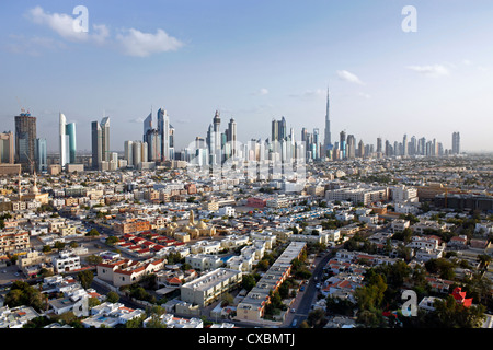 View of the new Dubai skyline of modern architecture and skyscrapers including the Burj Khalifa on Sheikh Zayed Road, Dubai Stock Photo