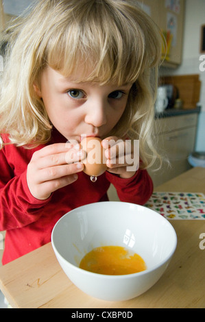 Berlin, child blows out Easter eggs Stock Photo
