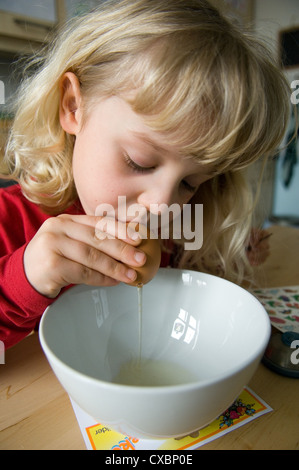 Berlin, child blows out Easter eggs Stock Photo