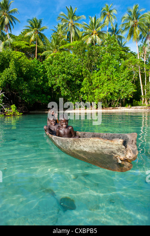 Young boys fishing in the Marovo Lagoon, Solomon Islands, Pacific Stock Photo