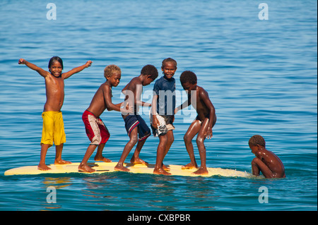 Happy children playing on the beach of Savo island, Solomon Islands, Pacific