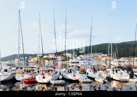 Cephalonia, Greece - Sept 12, 2012: Yachts moored at the fishing port of Fiskardo in the north of Kefalonia - morning light Stock Photo