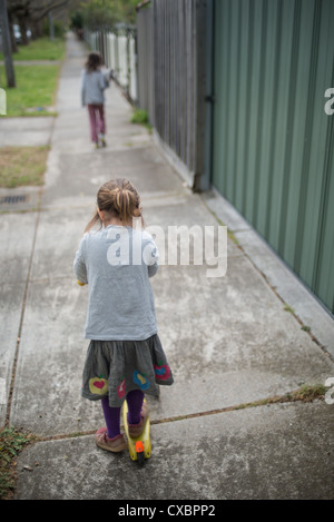 Two girls have fun on the street Stock Photo - Alamy