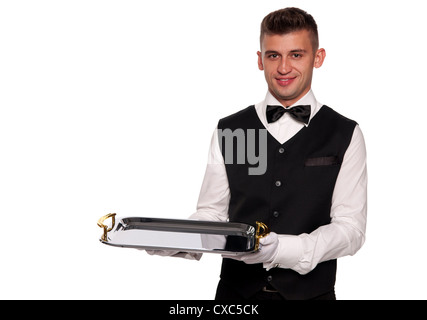 A young boy waiter with a tray. Isolated background Stock Photo