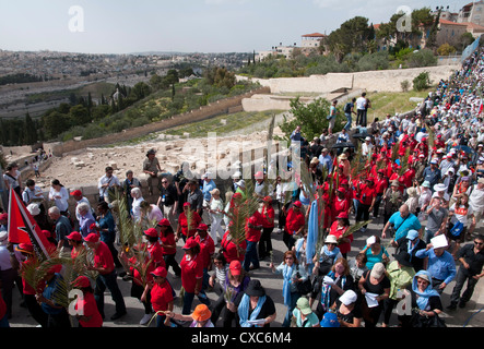 The Palm Sunday procession from Betphage to Sainte Anne in the Old City through the Mount of Olives, Jerusalem, Israel Stock Photo