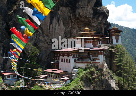 Taktshang Goemba (Tigers nest monastery) with prayer flags and cliff, Paro Valley, Bhutan, Asia Stock Photo