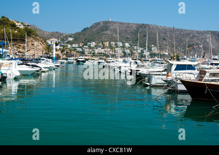 Boats at El Portet, Moraira, Spain with Cabo de Oro in the background Stock Photo