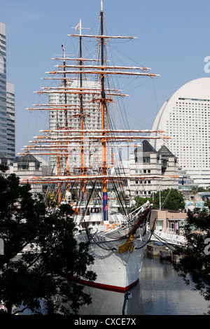 View of Nippon Maru, sailing ship in dock in Yokohama, with blue sky and green trees Stock Photo