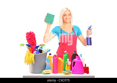 Young female cleaner with cleaning equipment isolated on white background Stock Photo