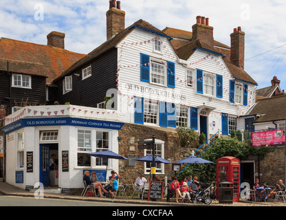 Old Borough Arms hotel and Mermaid Corner tea rooms with people sitting outside in Rye, East Sussex, England, UK, Britain Stock Photo