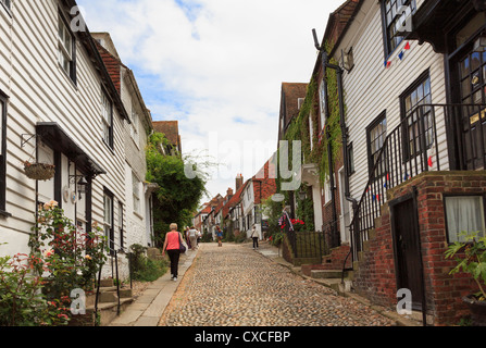 View up the famous narrow cobbled street lined with quaint old houses in Mermaid Street, Rye, East Sussex, England, UK, Britain Stock Photo