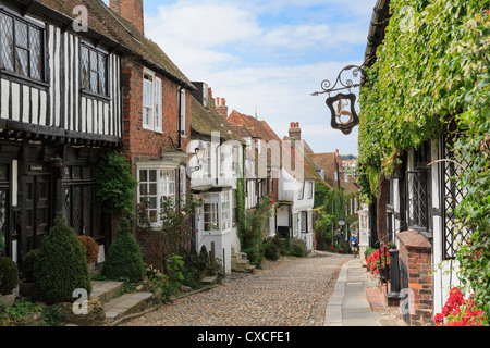 Famous narrow cobbled street with quaint old houses and haunted inn in historic Cinque Port town. Mermaid Street Rye East Sussex England UK Britain Stock Photo