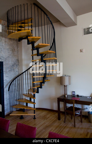 A spiral staircase leads to a rooftop terrace, Hotel 71, Quebec City, Canada Stock Photo