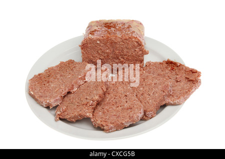 Slices of corned beef on a plate isolated against white Stock Photo