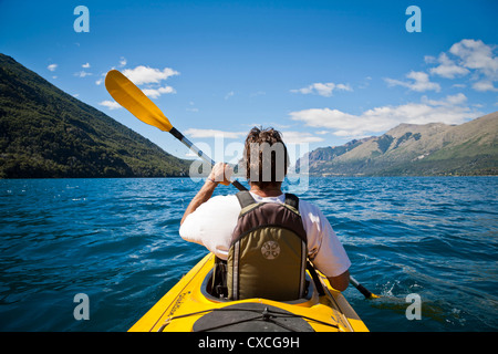 Kayakying at Guttierez lake in Estancia Peuma Hue, Lakes district, Patagonia, Argentina. Stock Photo