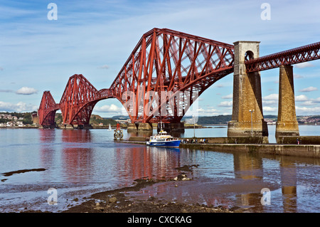 The Forth Belle moored at slipway by Forth Rail Bridge taking on passengers for  cruise to St Colm's Abbey on Inchcolm Scotland Stock Photo