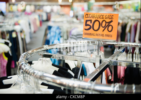 Clearance sale tag in clothing store Stock Photo