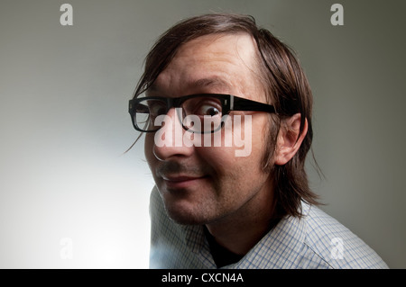 Big head nerd male close up portrait, this image is a humorous concept photo. Stock Photo