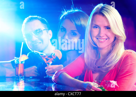 Portrait of happy friends having party in bar Stock Photo