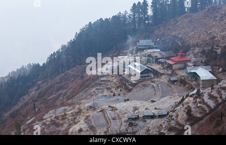 View of a rural village situated on a hillside in Nepal, Sing Gompa, Langtang Region Stock Photo