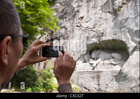 Chinese tourist at the Lion monument in Lucerne Stock Photo