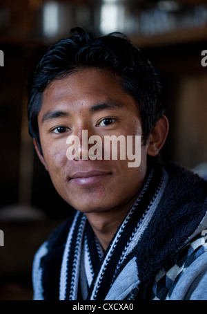 Portrait of a young Nepali man smiling, Nepal Stock Photo