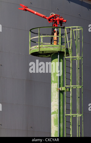Fire Hose / Nozzle at an oil / gas heavy industry plant Stock Photo