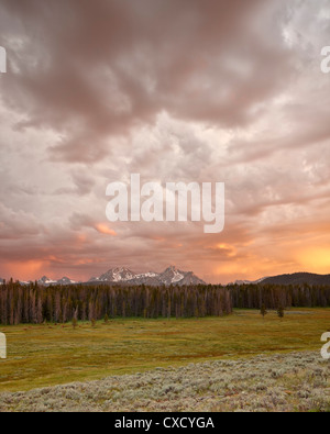 Orange clouds at sunset over The Sawtooth Mountains, Sawtooth National Recreation Area, Idaho, United States of America Stock Photo
