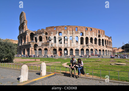 Rome, Italy - 30 March, 2012: Tourists visiting the Colosseum (Coliseum), one of the world's most famous landmarks Stock Photo