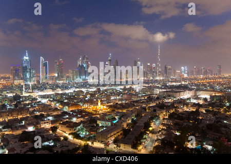 View of the new Dubai skyline of modern architecture and skyscrapers including the Burj Khalifa on Sheikh Zayed Road, Dubai Stock Photo