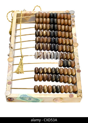 abstract composition from the old abacus, coins and shells isolated on white background Stock Photo