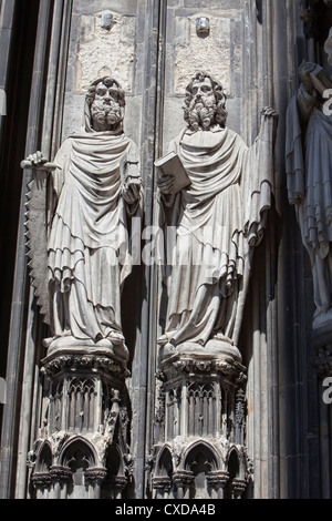 Limestone figures of an Apostle on the main portal, west façade, Cologne Cathedral, Germany, Europe Stock Photo