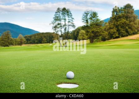 golf ball on tee in a beautiful golf club Stock Photo