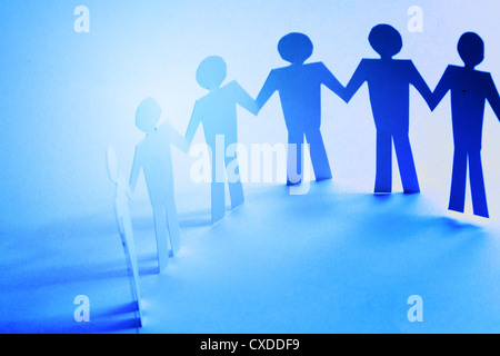 paper team linked together partnership concept Stock Photo