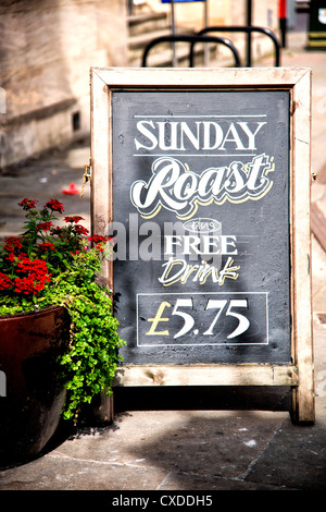 Menu outside a restaurant with advertisement for Stock Photo