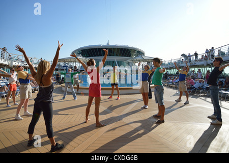 Dance troupe on sundeck of Royal Caribbean 'Grandeur of the Seas' cruise ship, Adriatic Sea, Mediterranean, Europe Stock Photo