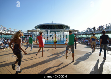 Dance troupe on sundeck of Royal Caribbean 'Grandeur of the Seas' cruise ship, Adriatic Sea, Mediterranean, Europe Stock Photo