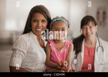 Mother and daughter in doctor's office Stock Photo