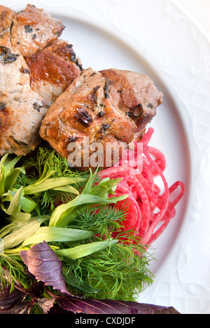 shashlik with potherbs on the plate Stock Photo