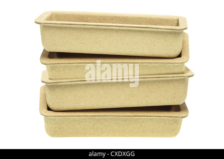 Stack of Recycled Paper Trays on White Background Stock Photo