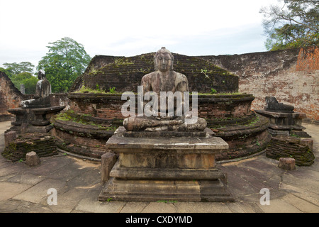 One of the Buddha statues on the upper platform, next to the stupa, Vatadage, Polonnaruwa, UNESCO World Heritage Site, Sri Lanka Stock Photo