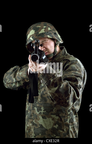 Armed man pointing a gun Stock Photo