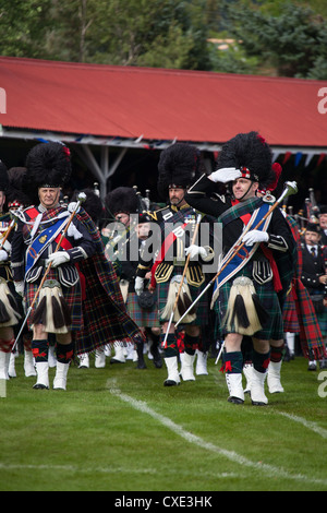 Village of Braemar, Scotland. The massed pipe bands marching at the Royal Braemar Gathering games. Stock Photo