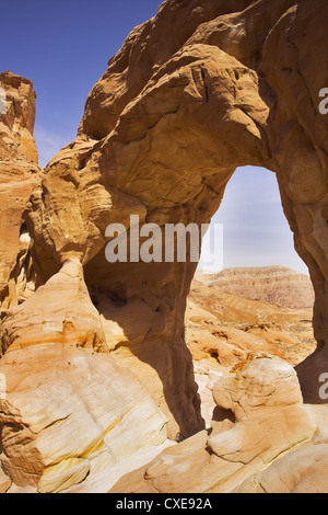 Erosive arch in hills from red sandstone Stock Photo