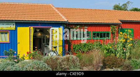 Colourful cabins of oyster farmers converted into arts and crafts shops at the port of Le Château-d'Oléron, Ile d'Oléron, France Stock Photo