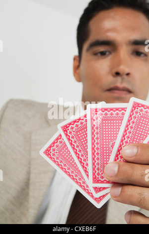 Man playing card game Stock Photo