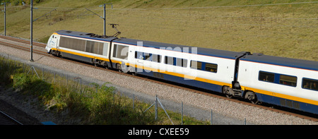 Eurostar high speed train passing through the Kent countryside towards London Stock Photo